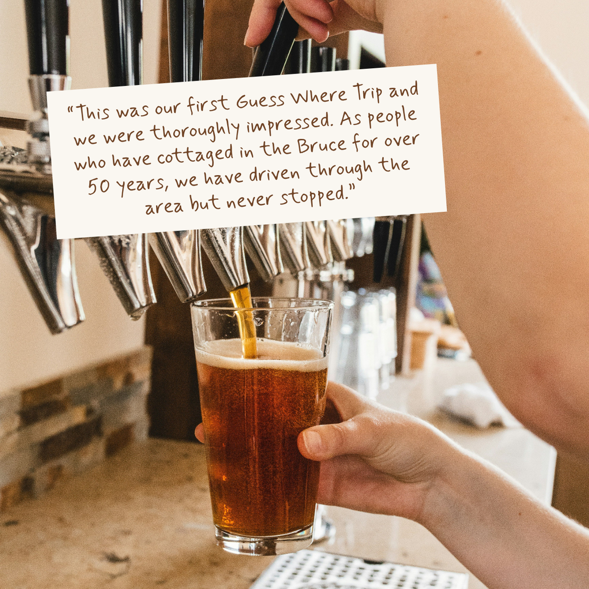 A person holds a pint of amber beer under a draft tap, with a handwritten note overlaid near the top. The scene appears to be in a bar or pub environment.