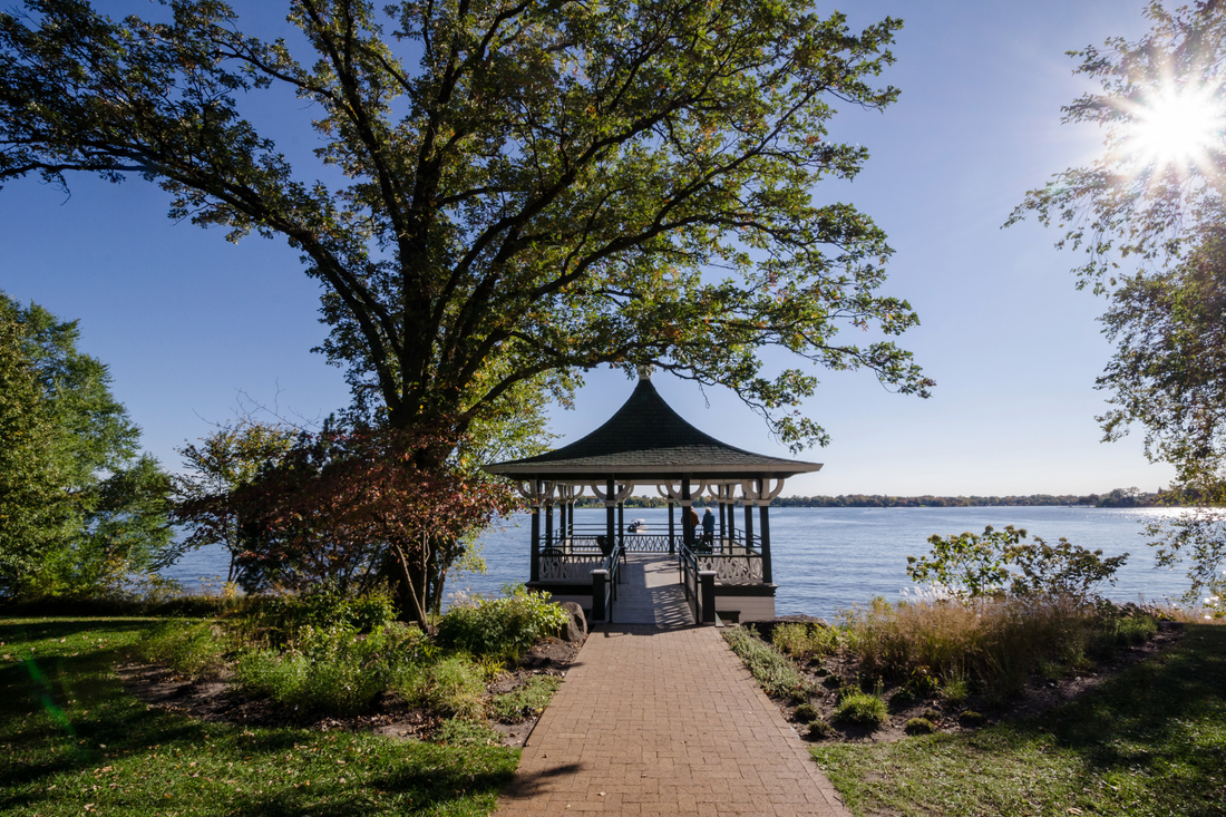 Gazebo overlooking a lake on a sunny day.