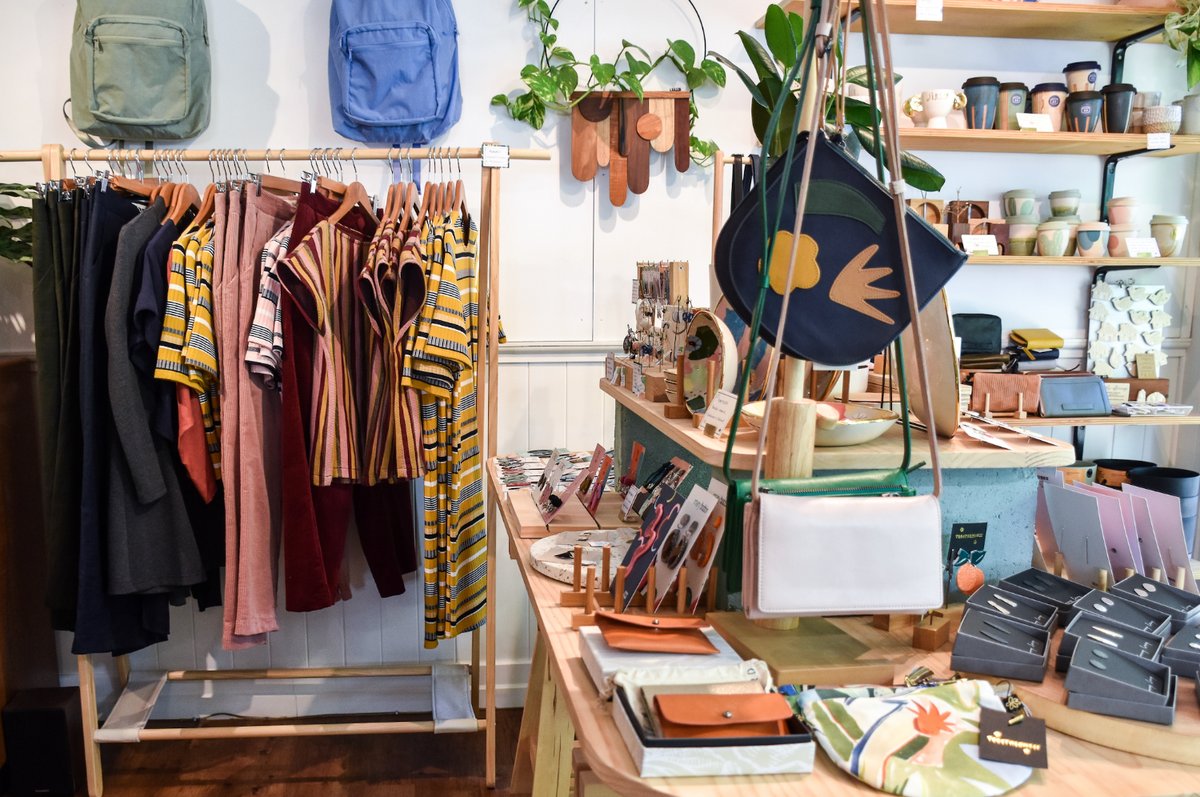 Boutique store with clothes, accessories, and home goods.