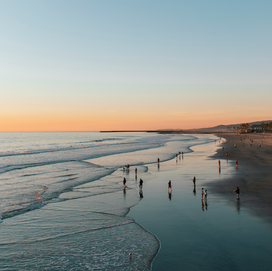 People on a beach in the morning.