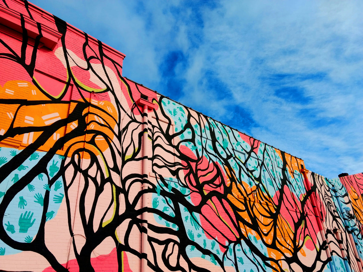 A wall covered in a colourful mural.