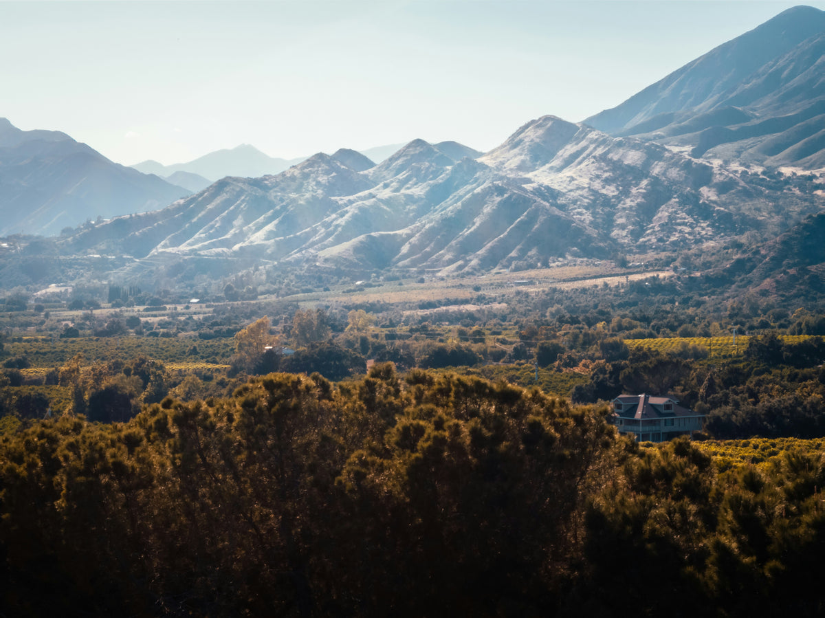Mountains rising above a hazy valley.