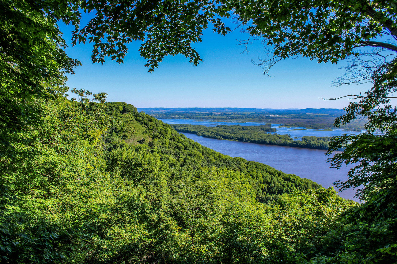 Forested mountain overlooking blue lakes.