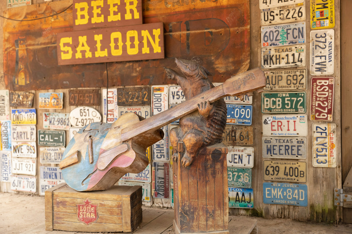 A rustic beer saloon covered in old licence plates.