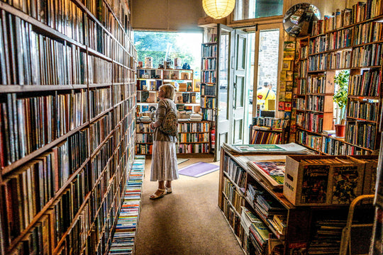 Woman browsing a used book shop
