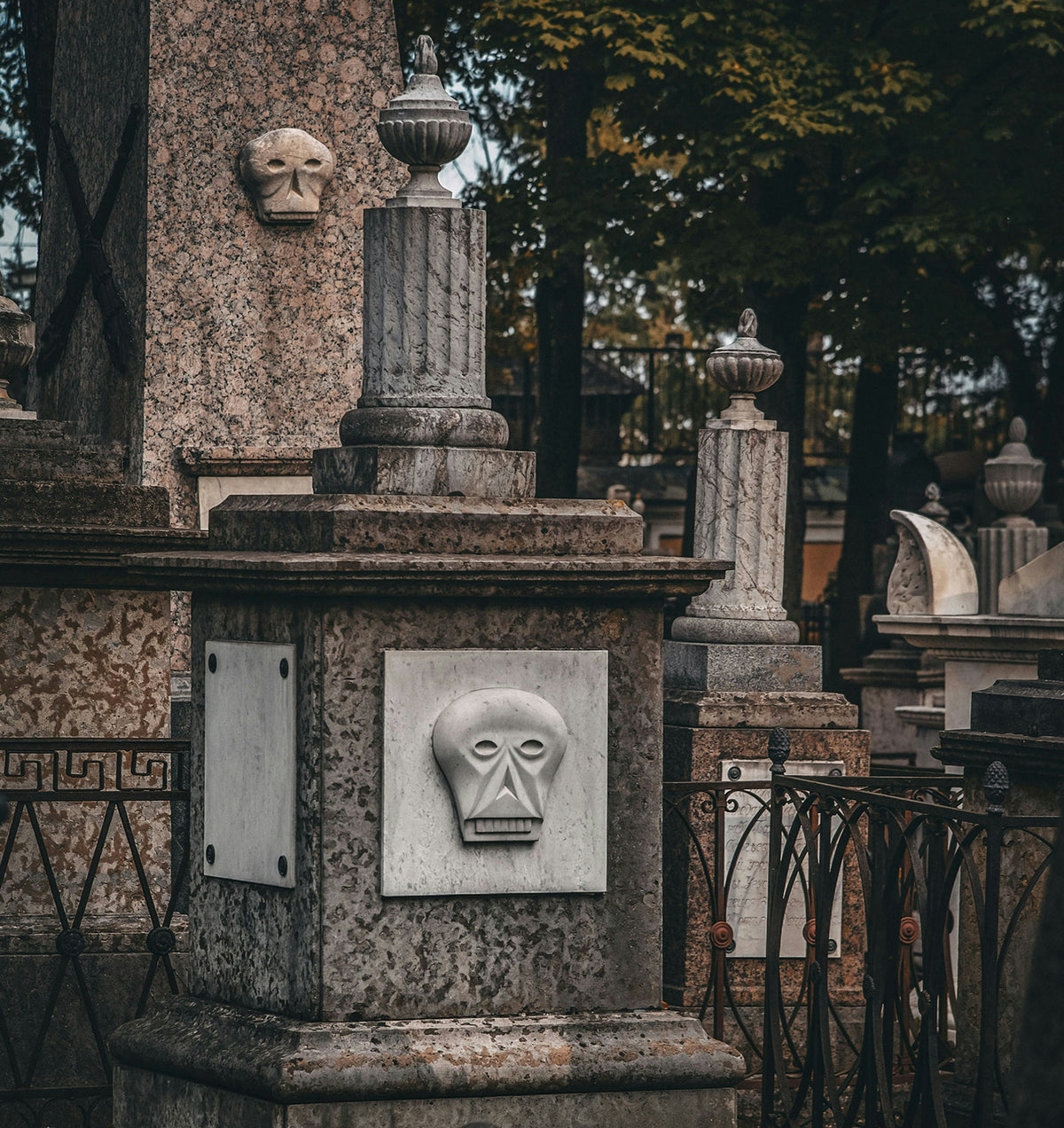 An old cemetery with ornate stone monuments.