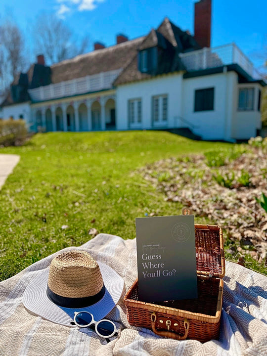 Picnic spread in front of white historic building.
