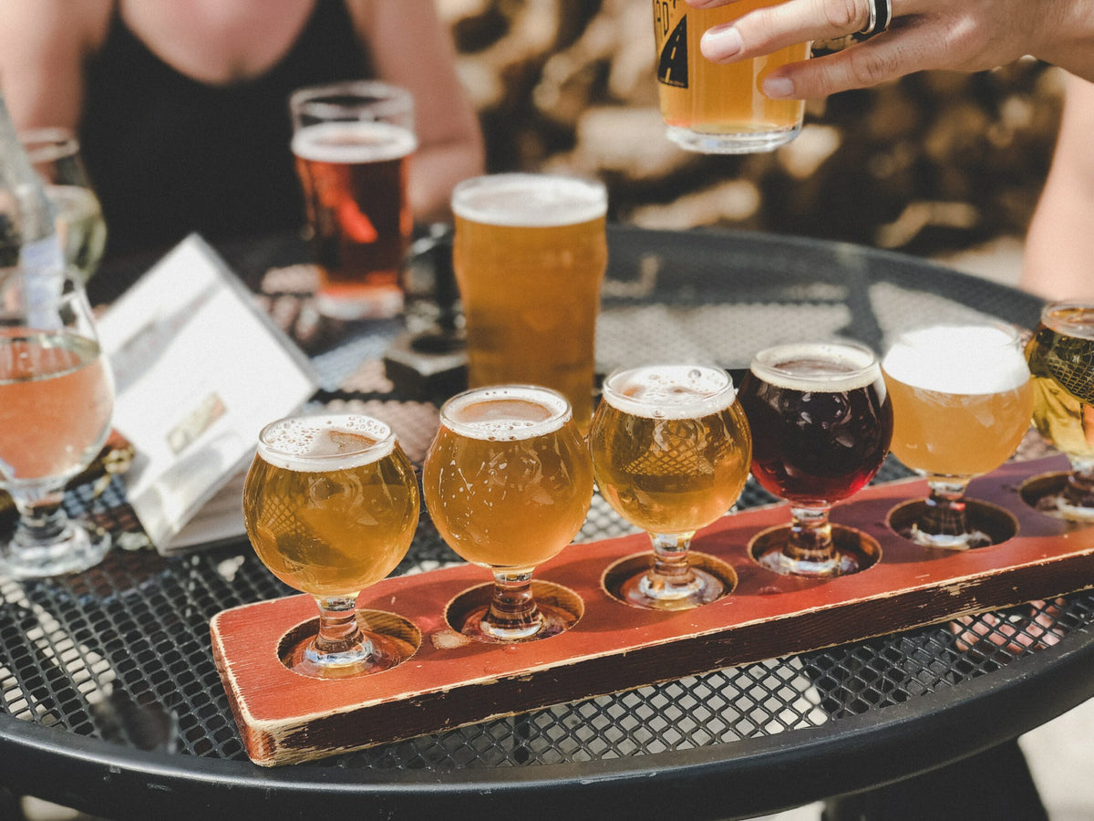 Patio table filled with beers.