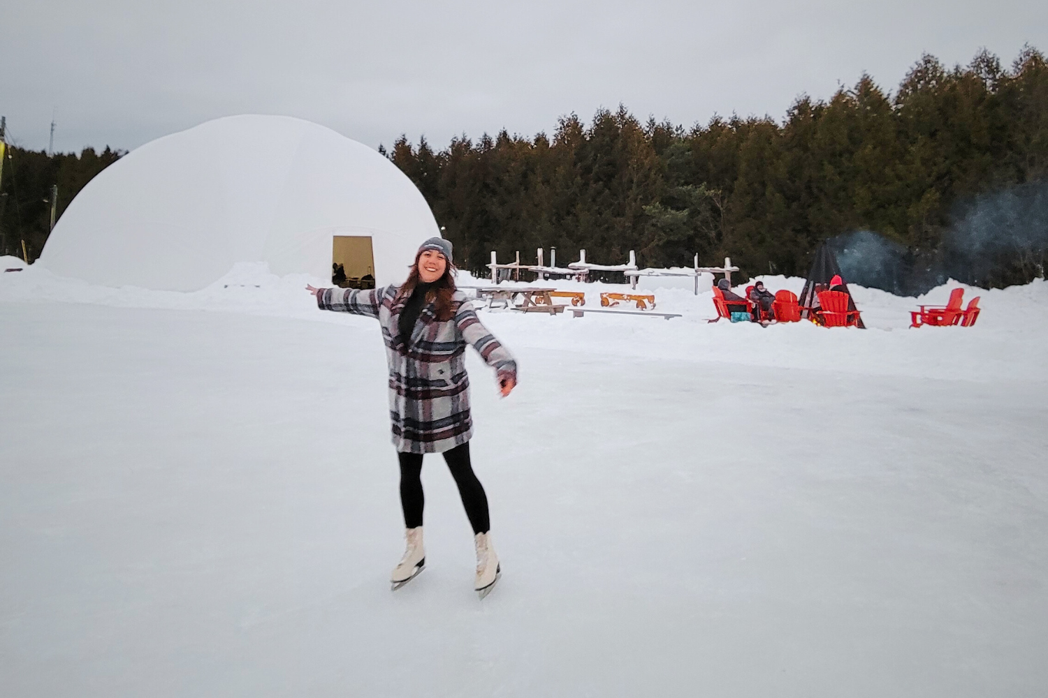 Woman skating on a lake in the winter time
