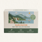 Vancouver Day Trip Box by Guess Where Trips, illustrated with mountains, evergreen forest, a waterfall, a suspension bridge and a ferry.