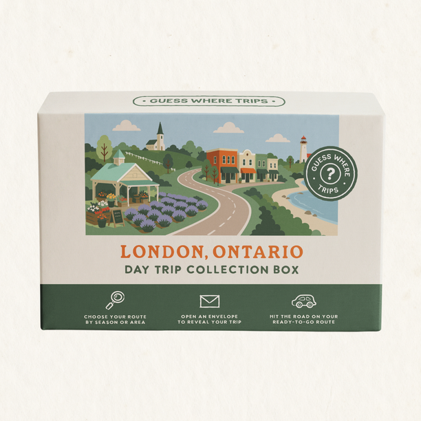 London Day Trip Box by Guess Where Trips, illustrated with a lavender field, a gazebo, a small-town main street and a lakeside lighthouse.