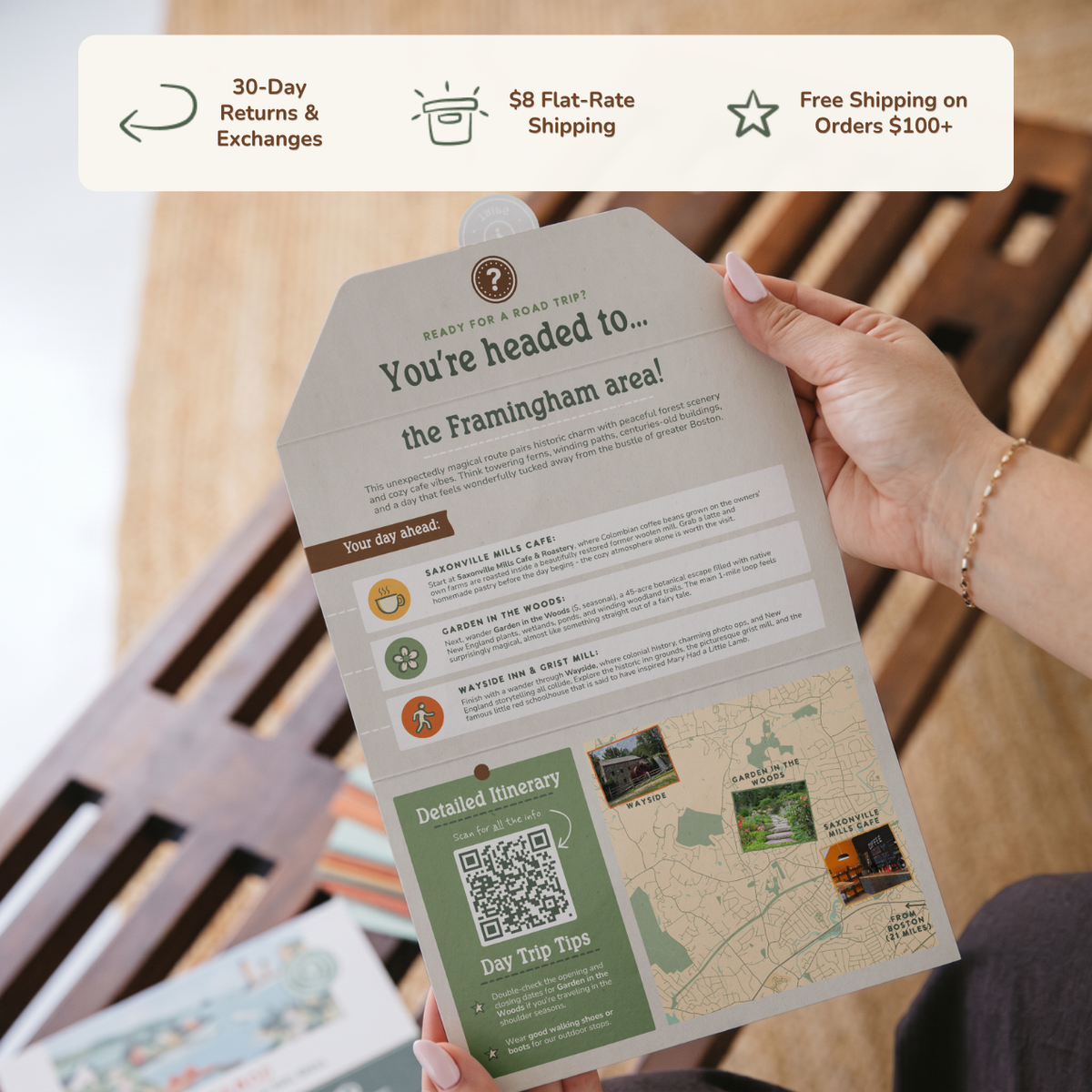 Hands holding an open itinerary card. Banner reads: 30-day returns and exchanges, $8 flat-rate shipping, free shipping on orders $100+.