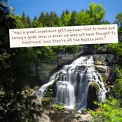 A scenic photograph of a multi-tiered waterfall flowing over rocks, surrounded by lush green trees and foliage under a blue sky. A cream-colored rectangular card with a brown quote is superimposed near the top center.