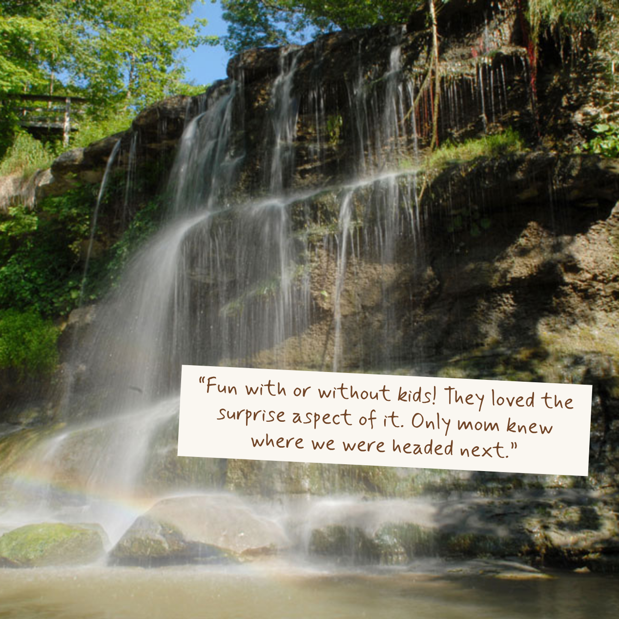 A scenic waterfall in a forest with a small white paper tag overlaid near the bottom center containing a quote about kids and surprise exploration.