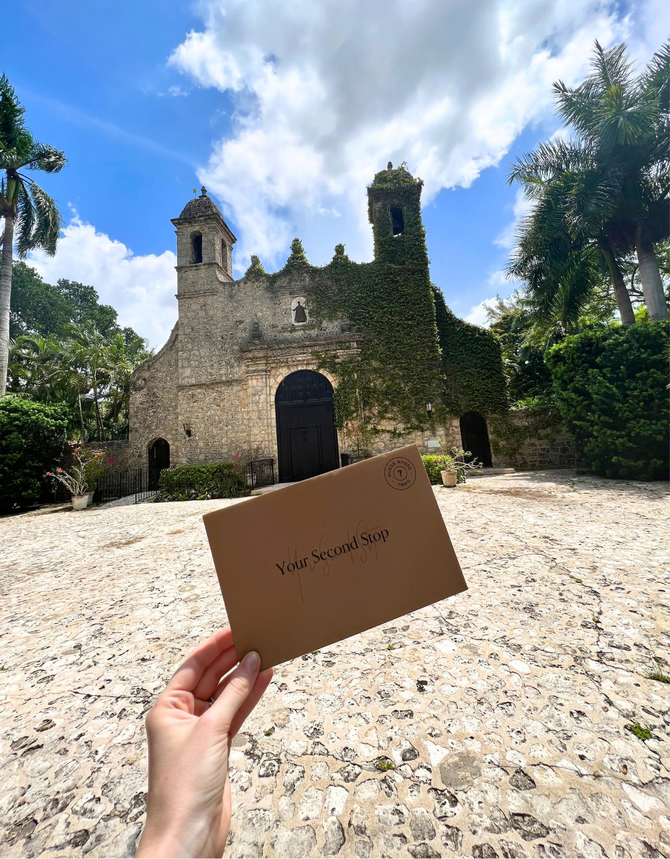 Hand holding second stop envelope on a Florida day trip.