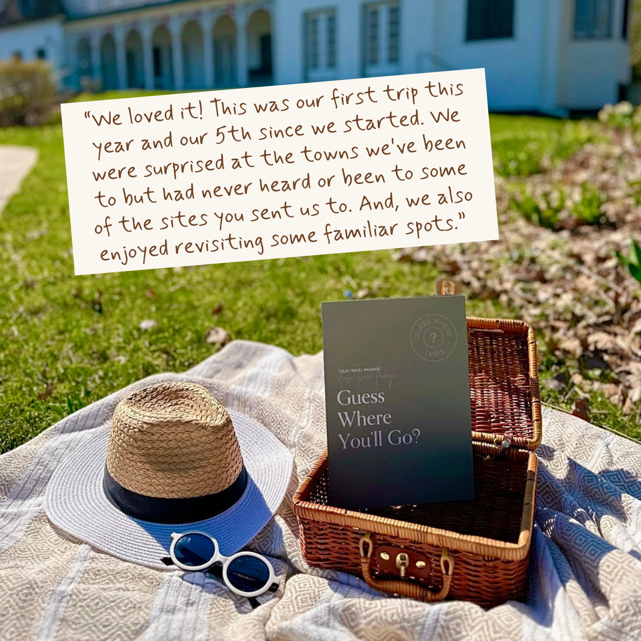 A picnic-style outdoor scene with a straw hat, blue visor, white sunglasses, a woven basket, and a book titled "Guess Where You'll Go" placed on a blanket. A handwritten note is overlaid near the top, and the background shows a real outdoor setting with grass, flowers, and a house.