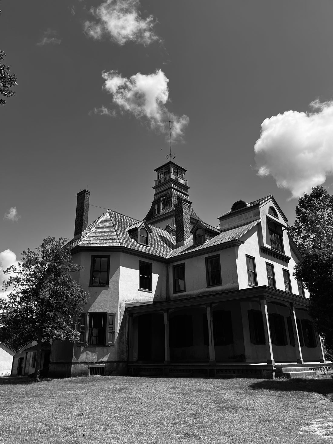 Black and white photo of an old house.
