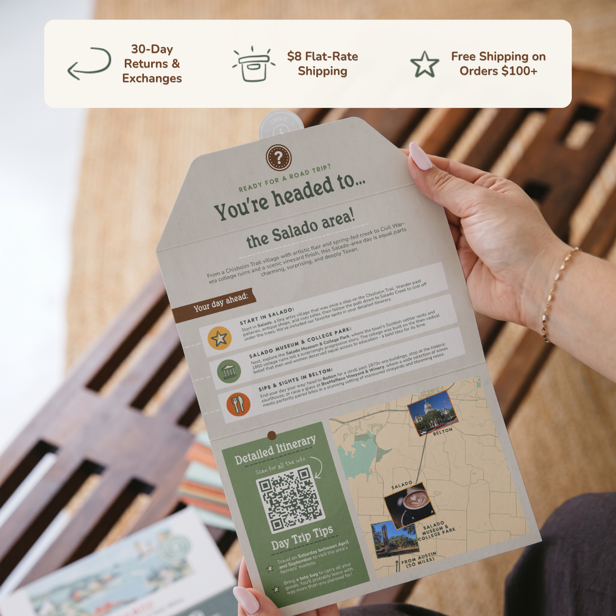 Hands holding an open itinerary card. Banner reads: 30-day returns and exchanges, $8 flat-rate shipping, free shipping on orders $100+.