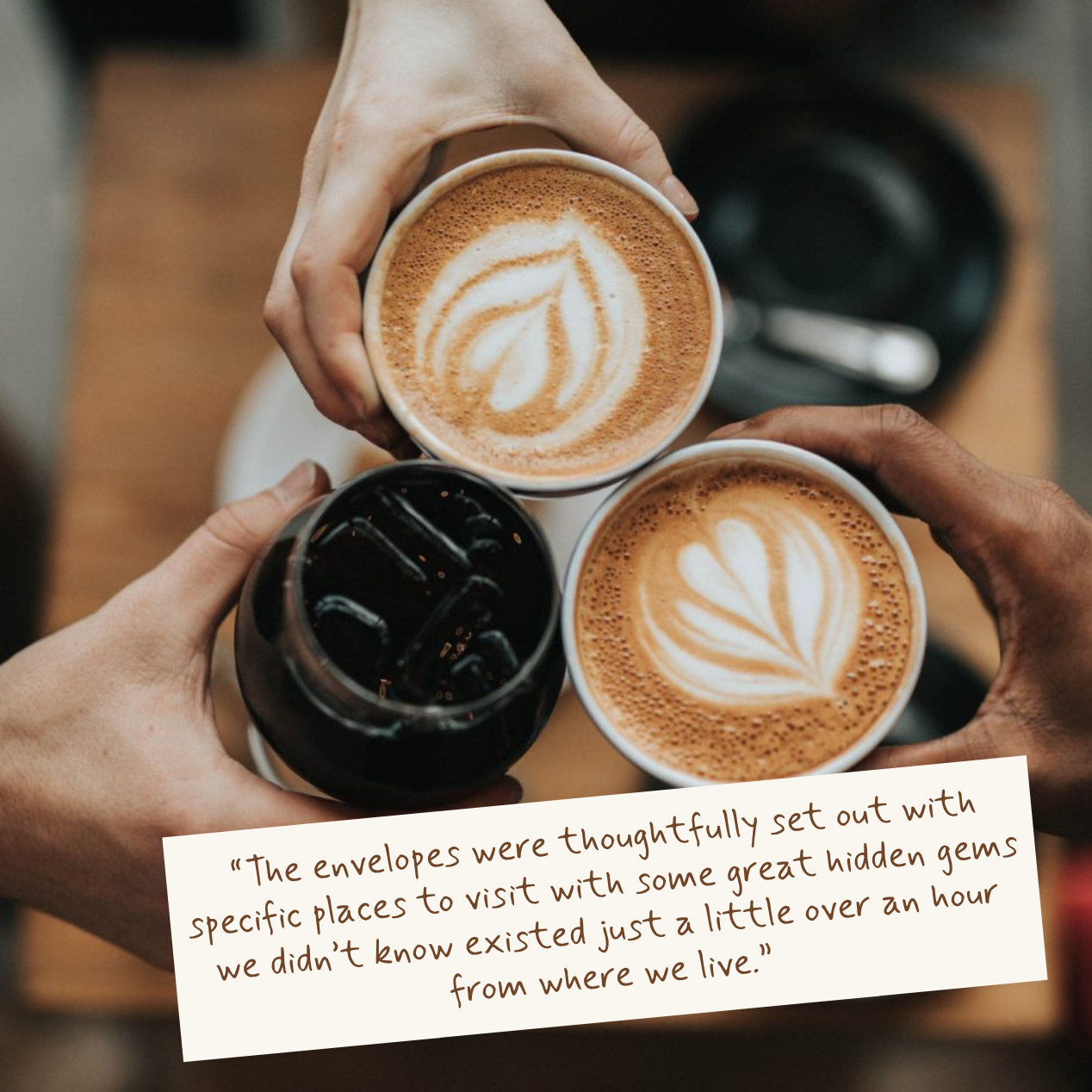 Three coffee drinks held together, two hot with foam designs, one iced coffee.