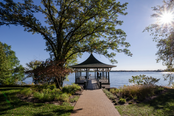 Gazebo overlooking a lake on a sunny day.