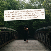 A woman stands on a wooden bridge in a forest, facing away from the camera. A large white text box overlays the upper left portion of the image with a quote about outdoor adventures and good eats.