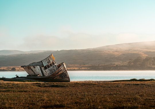 Abandoned boat on the shore.