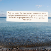 A square white card with a printed quote about a fun beach adventure, placed over a real beach scene with blue water, sky, and pebbled shore.