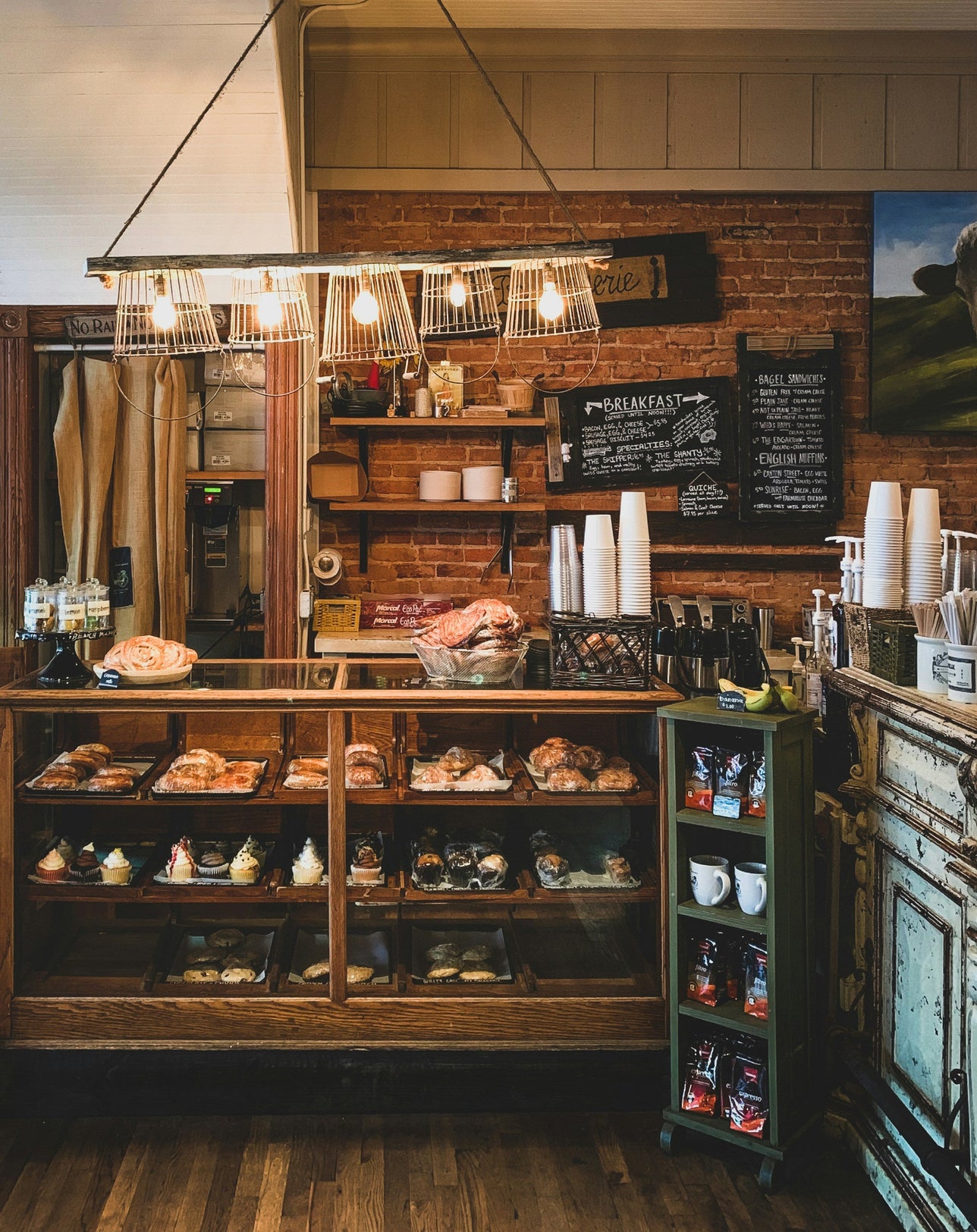 Interior of cafe with a baked goods on display.