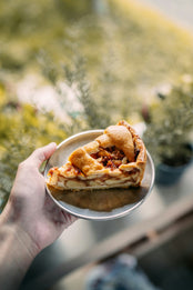Apple pie on a metal plate.