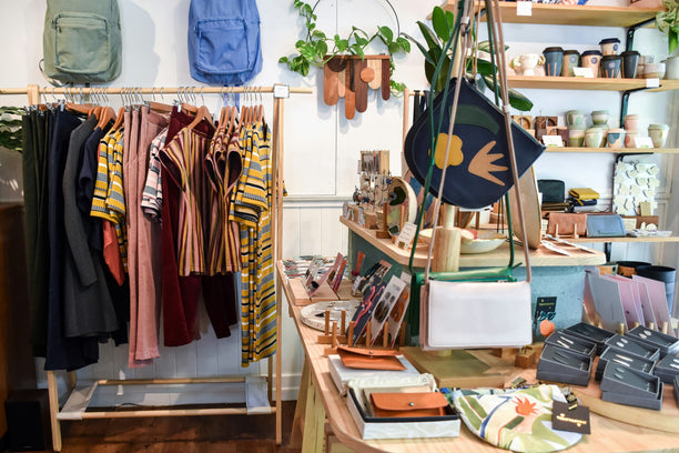 Clothing and gifts in a boutique shop.