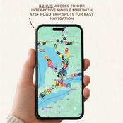 A hand holds a smartphone displaying an interactive mobile map with colorful location pins and navigation spots. Text at the top reads: 'BONUS: ACCESS TO OUR INTERACTIVE MOBILE MAP WITH 575+ ROAD TRIP SPOTS FOR EASY NAVIGATION.