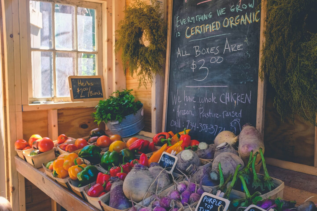 Vegetable market with chalk sign.