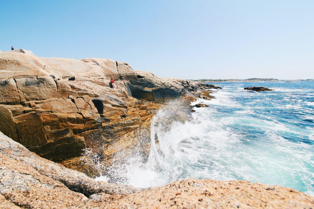 Waves crashing on rocky coastline.