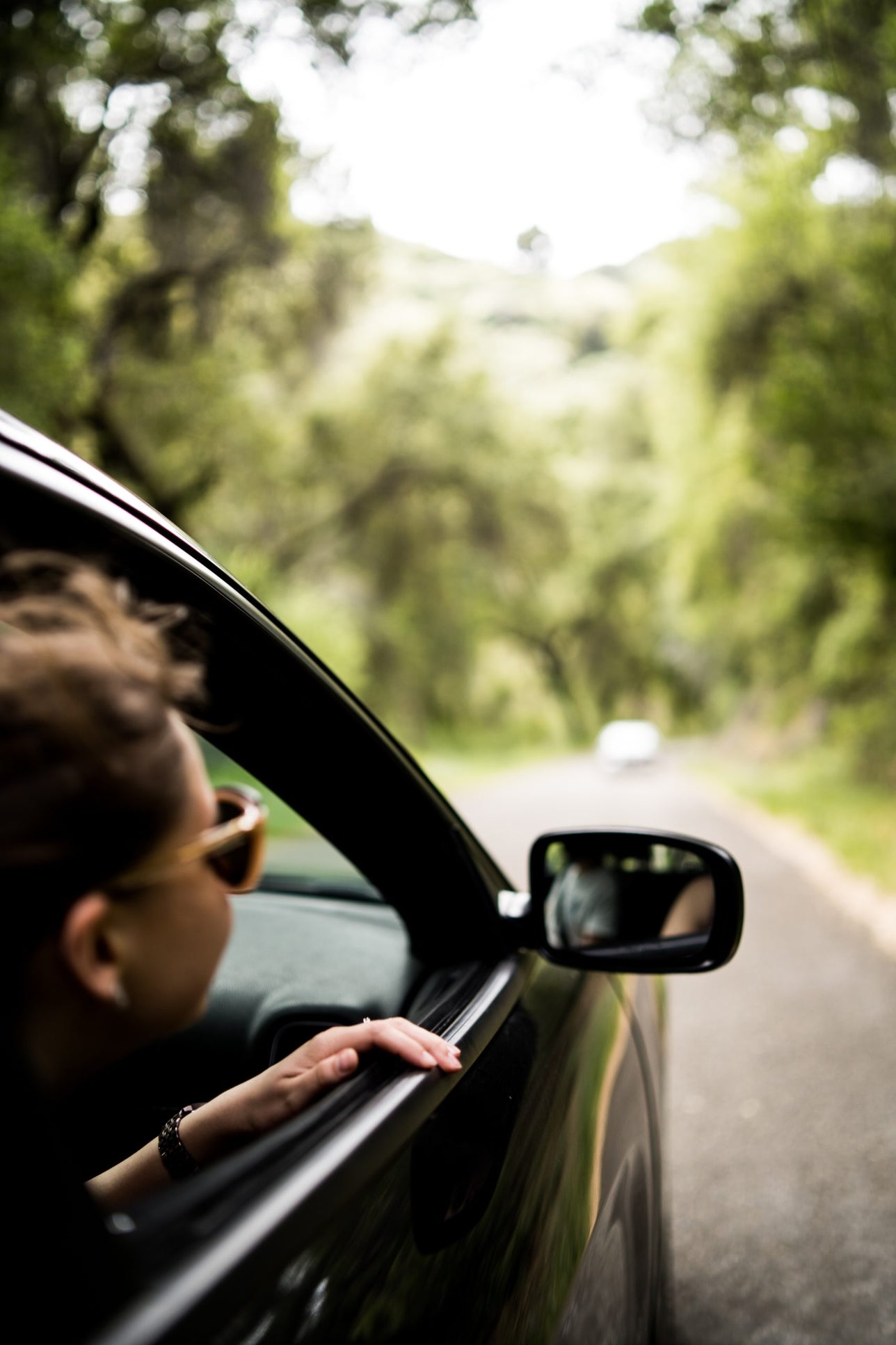 Woman looking out of car window.